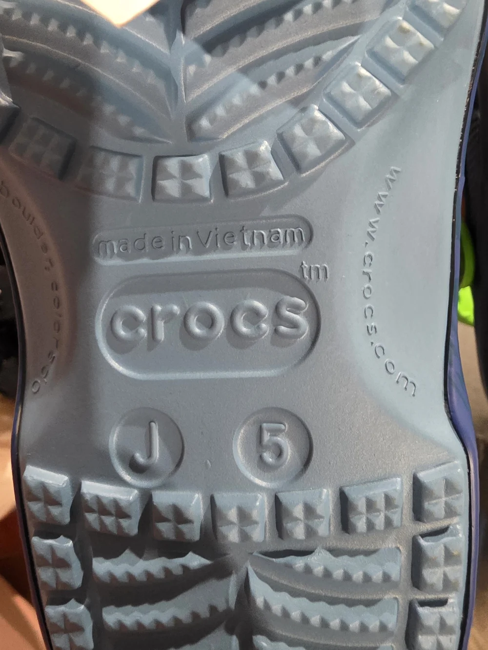 CROCS Kids Blue Clog Sandals with Neon Green Straps and Decorative Charms